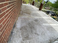 During pictures of a porch patio and set up steps we power washed, repaired, resurfaced, applied primer, and (2) coats of elastomeric Saf-T-Dek grey paint. 