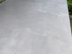 After pictures of a porch patio we power washed, repaired using polymer cement, applied primer, and (2) coats of elastomeric Saf-T-Dek grey paint.