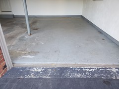 This is a "before" photo of the garage floor.  Note the spalling from salt damage and the many cracks throughout the floor.  