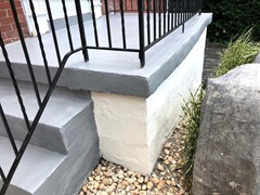 After pressure washing and repairing the side of these steps, a new finish coating drastically changed their look
