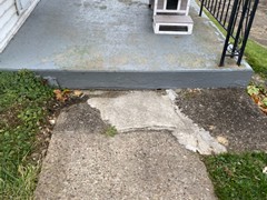 This is the sidewalk leading up to the stairs shown in the previous picture.  It is also in need of major repairs.