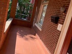 The front porch needed crack repair and restoration. After power washing, we V-out cracks to prepare them for flexible urethane, which contracts and expands with the freeze/thaw cycle so cracks are always protected for further damage. The finish coat on this porch was the terracotta colored Saf-T-Deck elastomeric coating with non-skid surface