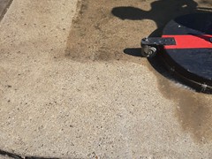 Here's a picture of our employee using our high pressure deck scrubber to properly clean concrete. You can tell the difference almost immediately when clean.