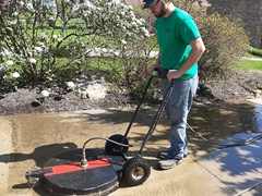 Here's a picture of our employee using our high pressure deck scrubber to properly clean concrete. You can tell the difference almost immediately when clean.