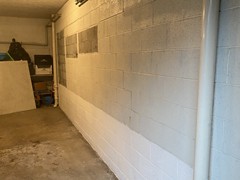 This customer had two (2) bowing walls in the basement.  They both were bowing approximately two (2) inches.  This is a photo of the first bowing wall.