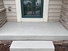 This is the photo.  Following repair and resurfacing, the porch and step look like new!