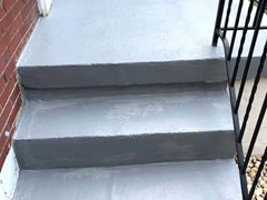 After pressure washing and repairing the side of these steps, a new finish coating drastically changed their look